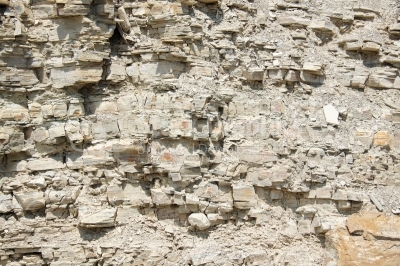 A cliff face with stratified rocks