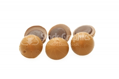 A pile of toffee chocolates on white background