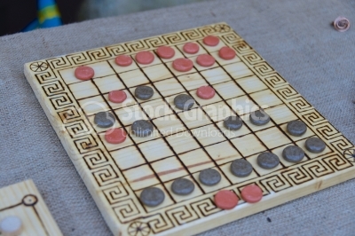 A Roman board game with red and black stones