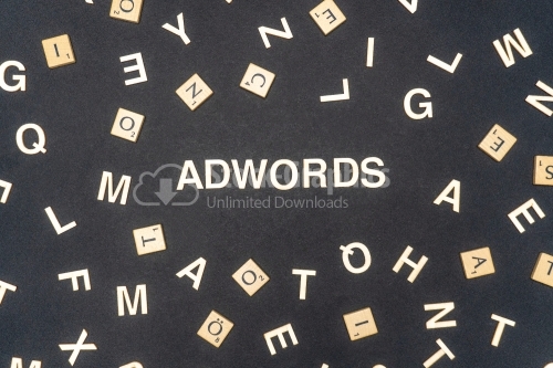 ADWORDS word written on dark paper background. ADWORDS text for your concepts