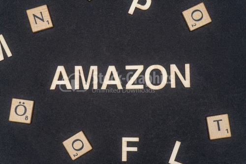 AMAZON word written on dark paper background. AMAZON text for your concepts