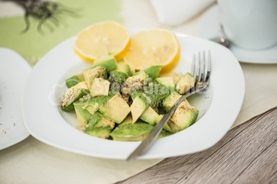 Avocado salad with lemon and aromatic herbs