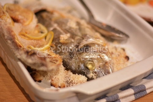 Baked trout in salt crust. The crust is removed from the fish.