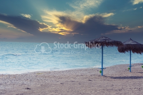Beach with two umbrellas