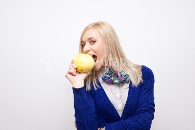 Beautiful woman eating grapefruit