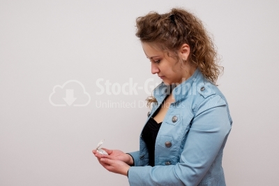 Beautiful woman holding clock