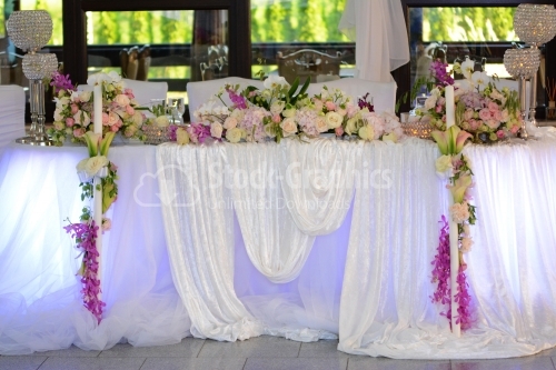 Big wedding table with lots of flowers and details