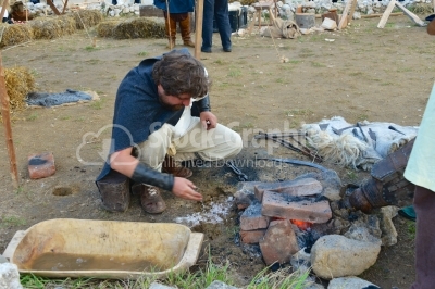 Blacksmith working on a medieval festival