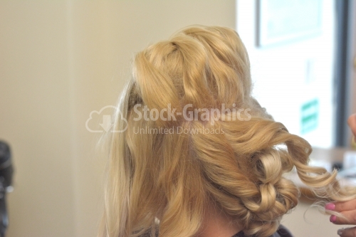 Blond woman curly hair detail