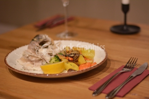 Boneless fish with sauteed vegetables.