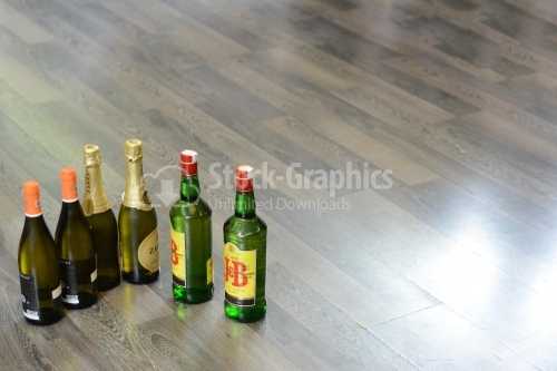 Bottles of wine, champagne and whiskey placed on the floor