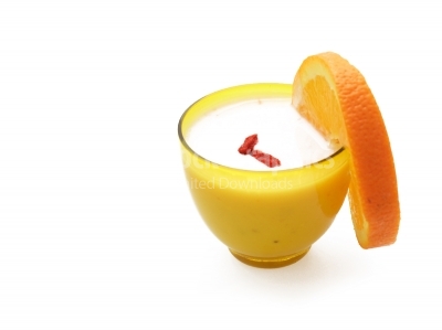 Bowl with yogurt and orange slice