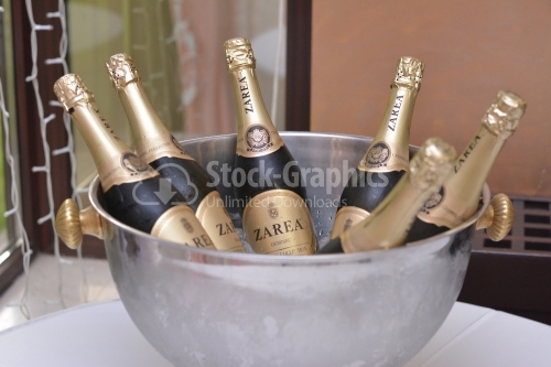 Bucket with bottles of champagne