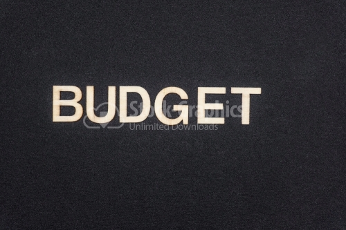 BUDGET word written on dark paper background. BUDGET text for your concepts