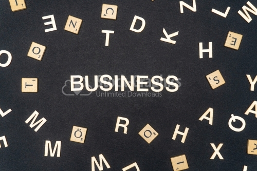 BUSINESS word written on dark paper background. BUSINESS text for your concepts