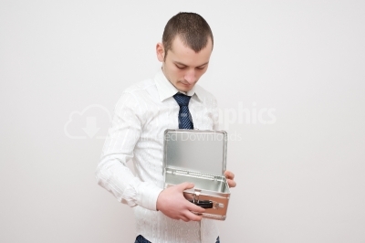 Businessman looking in metal box