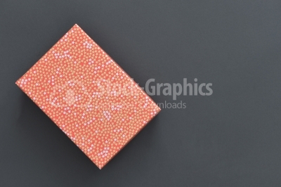 Christmas holiday gift box in spotted paper isolated 