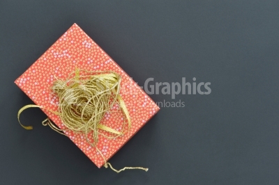 Christmas holiday gift box in spotted paper with gold