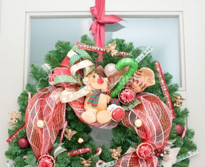 Christmas wreath with red ribbon and small ornaments
