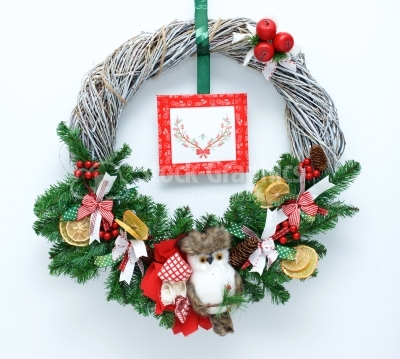Christmas wreath with small litte owl as decoration