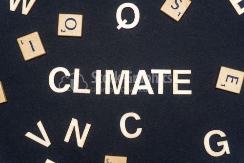 CLIMATE word written on dark paper background. CLIMATE text for your concepts
