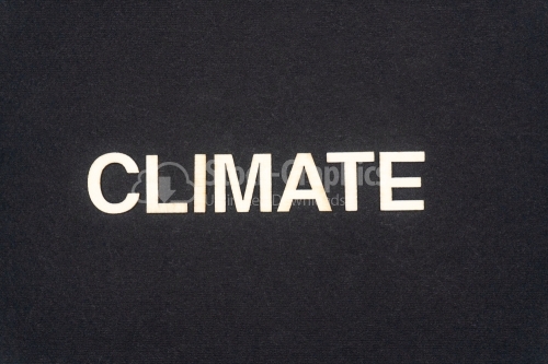 CLIMATE word written on dark paper background. CLIMATE text for your concepts