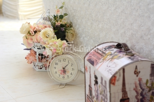 Clock chest and flower arrangements