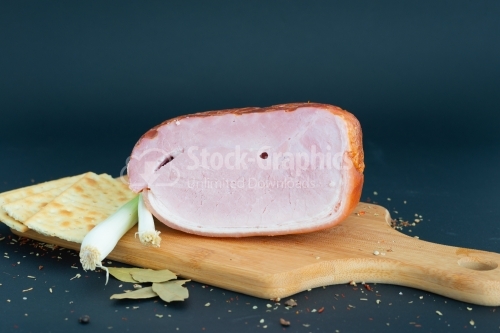 Close up Prague baked ham isolated on cutting board
