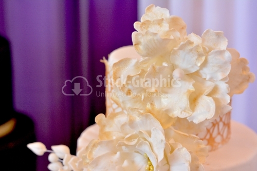 Close-up of beige marzipan flowers with gold glitter
