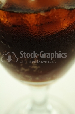 Cola with ice and lemon in a glass - Stock Image