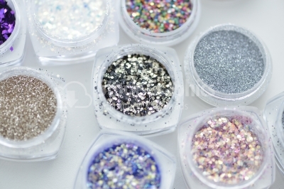 Collection of nail glitters of different colors, close up.
