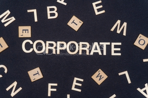 CORPORATE word written on dark paper background. CORPORATE text for your concepts
