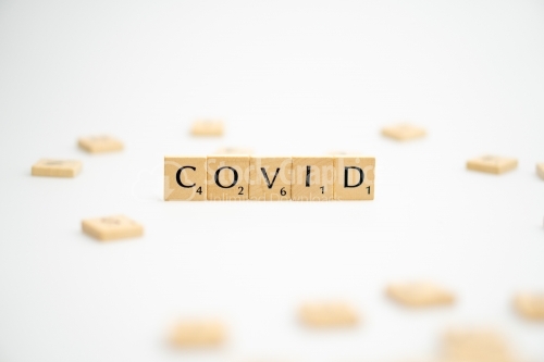 COVID word written on white background. COVID text on white