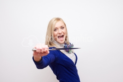 Crazy young woman holding a knife