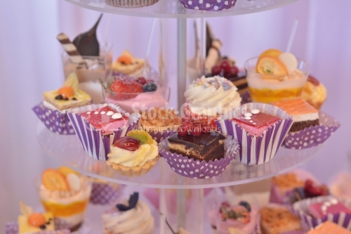 Cream layers cakes and variety puddings with assorted fruits. Candy bar
