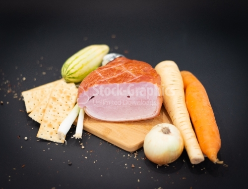 Cutting board with lots of vegetables and Smoked ham