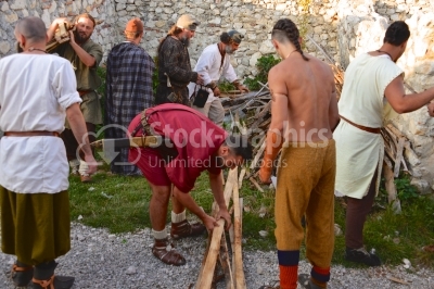 Dacian mens working toghether at a festival
