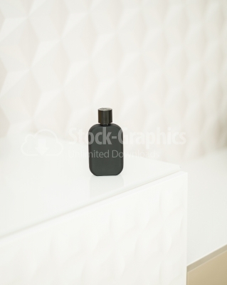 Dark vertical perfume bottle
