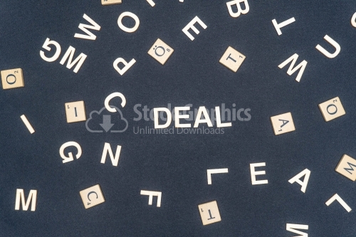 DEAL word written on dark paper background. DEAL text for your concepts