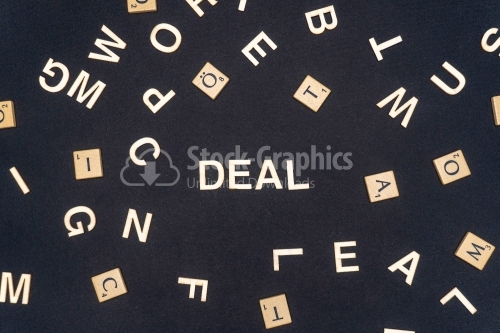 DEAL word written on dark paper background. DEAL text for your concepts