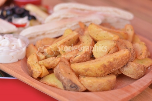 Delicious edges potatoes in golden crust.