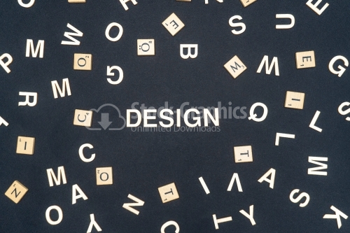 DESIGN word written on dark paper background. DESIGN text for your concepts