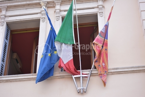 European flag and italian flag on window