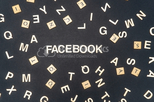 FACEBOOK word written on dark paper background. FACEBOOK text for your concepts