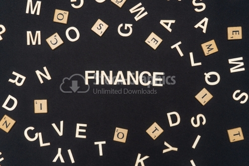 FINANCE word written on dark paper background. FINANCE text for your concepts
