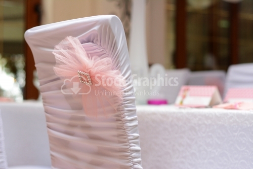 Floral pink bow on a wedding chair