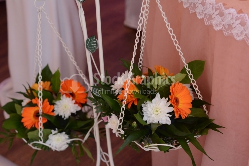 Flower arrangements hanging on a vase