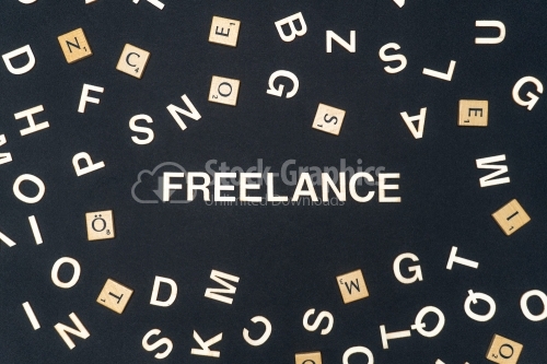 FREELANCE word written on dark paper background. FREELANCE text for your concepts