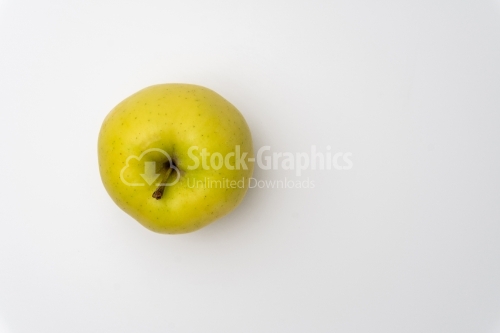 Fresh "Golden Delicious" apple on a white background