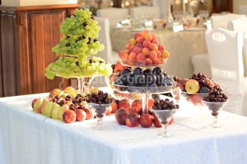 Fruit bowl with grapes, apricots, nectarines, plums, pears, cherries